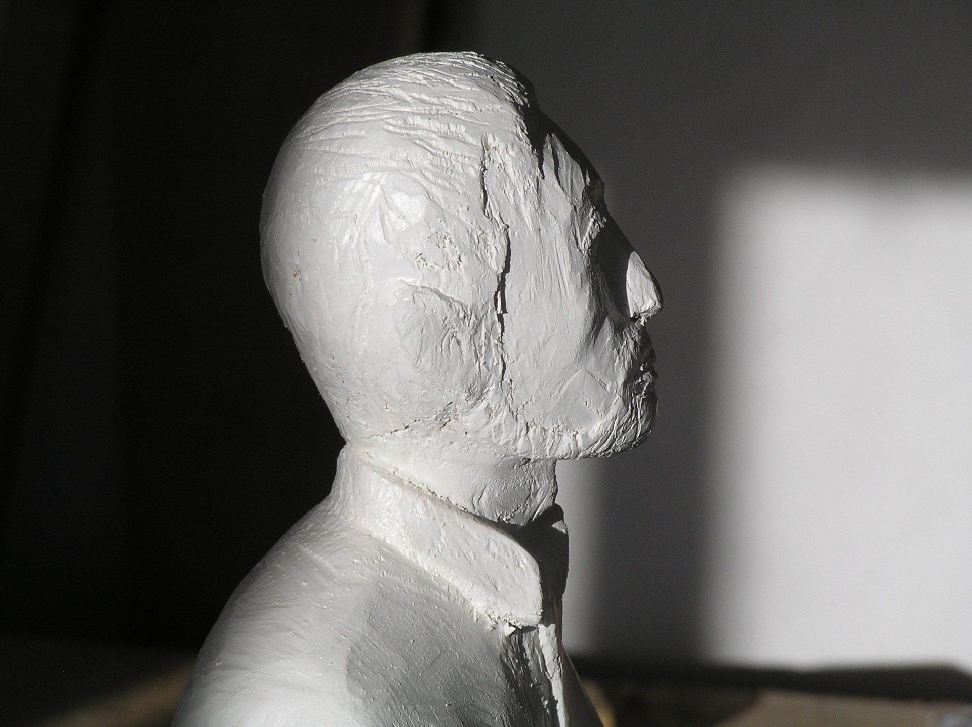 A male wooden figure made by Ingrained Culture