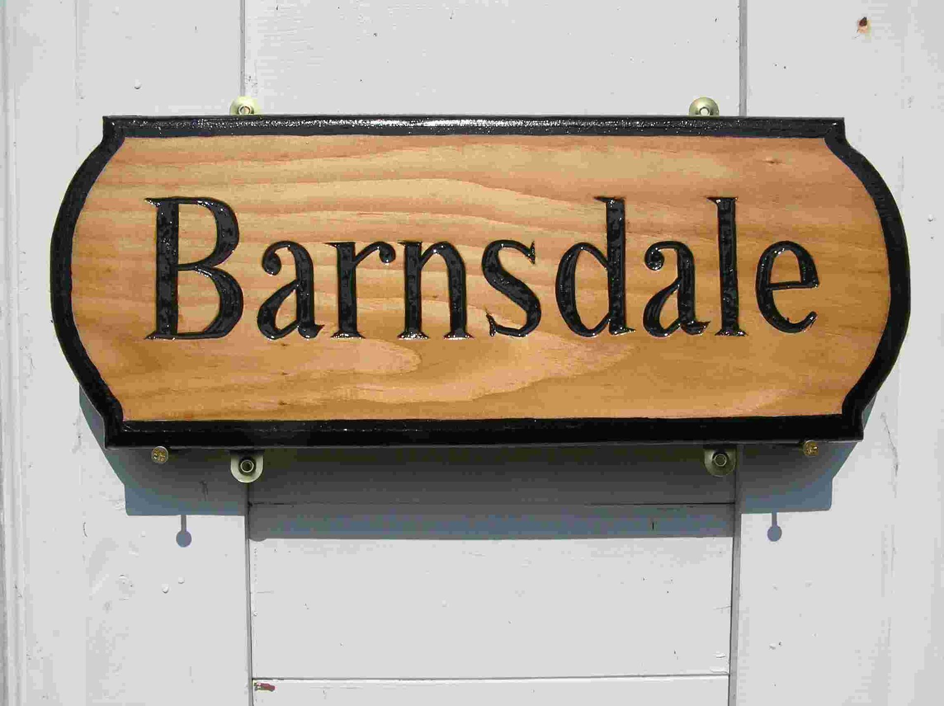 Traditional wooden house name plaque , with a black painted border by Robert Ingrained Culture