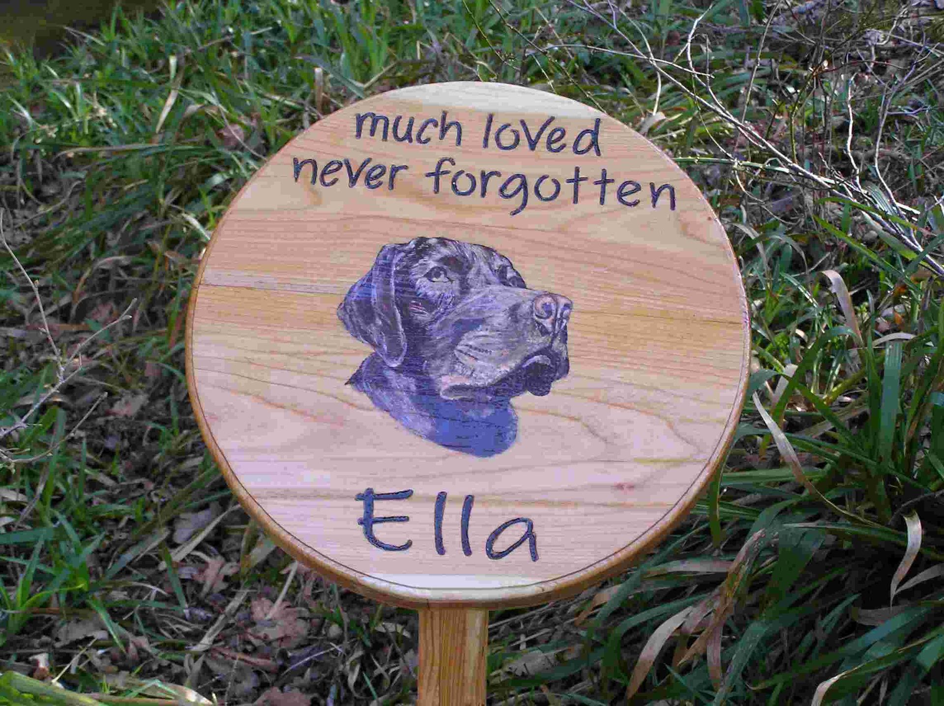 A handmade wooden pet memorial with a painted animal portrait made by Robert, Ingrained Culture