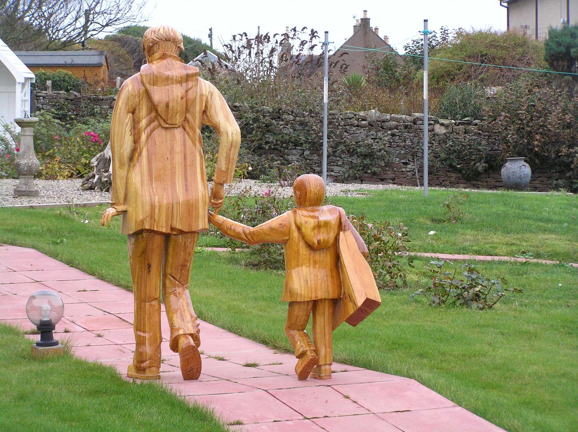 A contemporary wooden garden statue made by Ingrained Culture