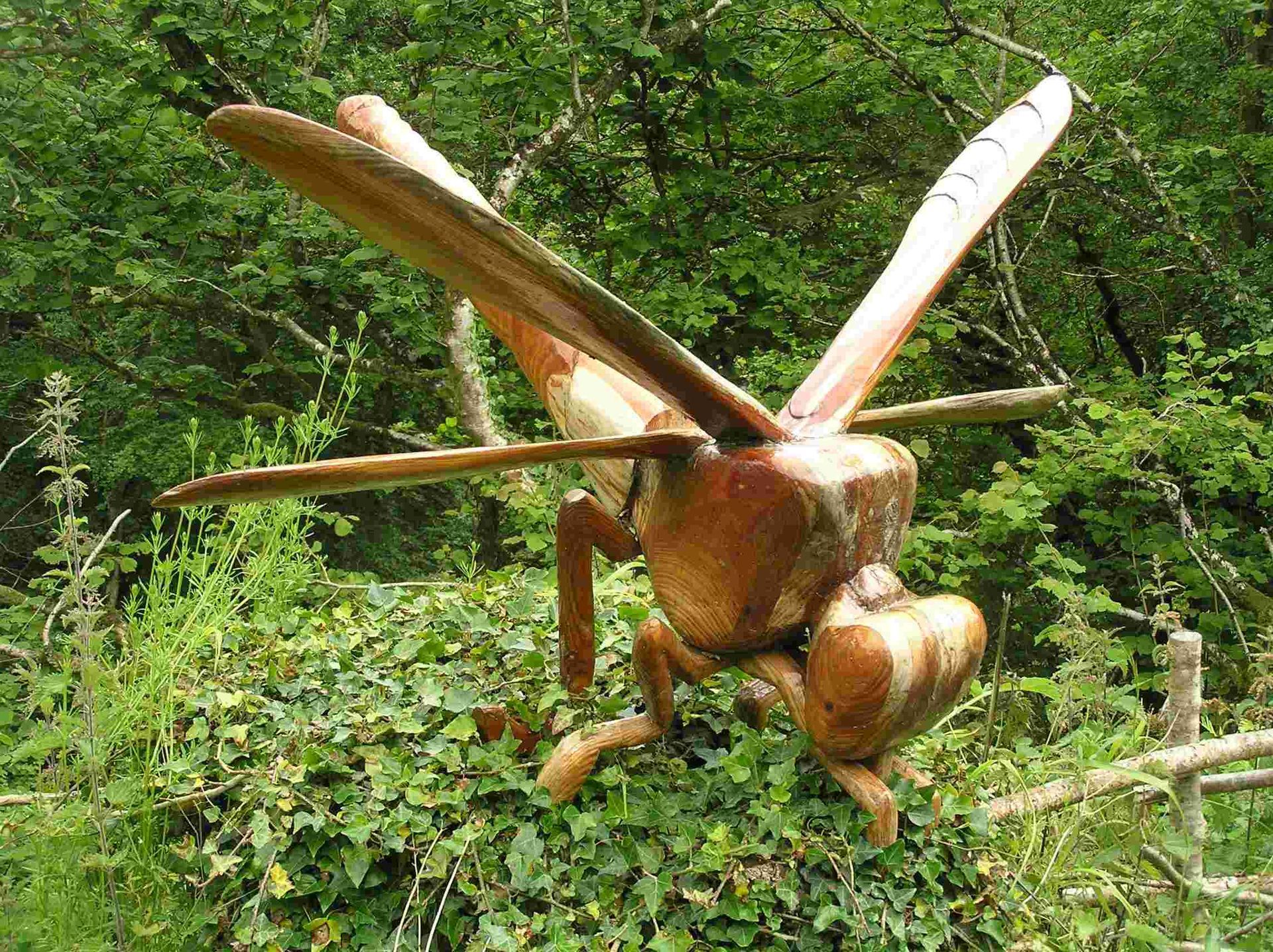 A wooden insect garden sculpture made by Robert Ingrained Culture