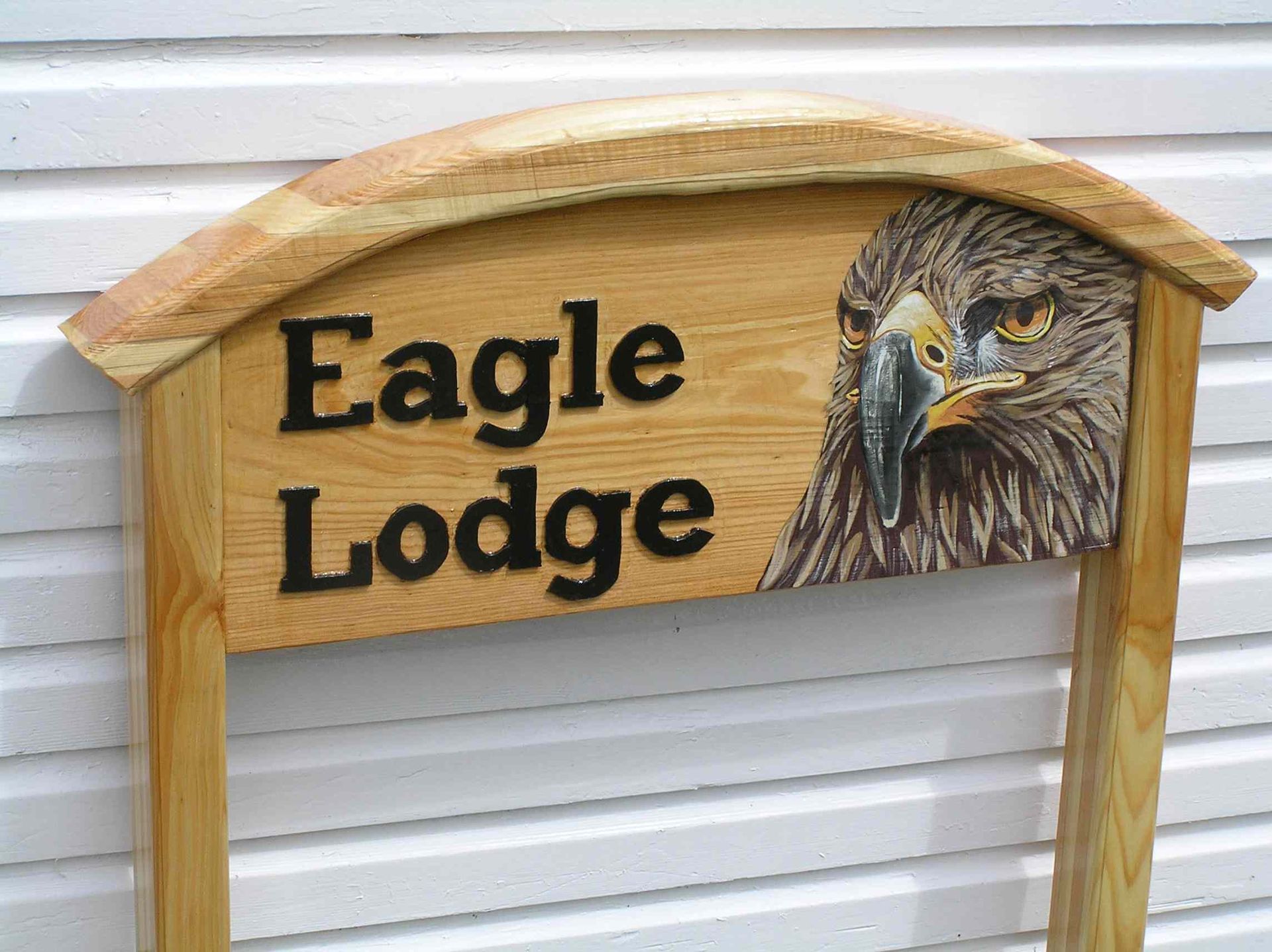 a wooden house sign with picture handmade and hand painted by Ingrained Culture