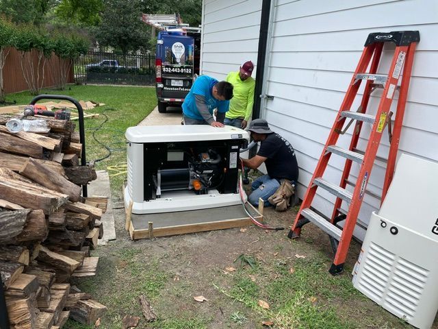 Workers install equipment beside a house, with an orange ladder leaning against the siding.