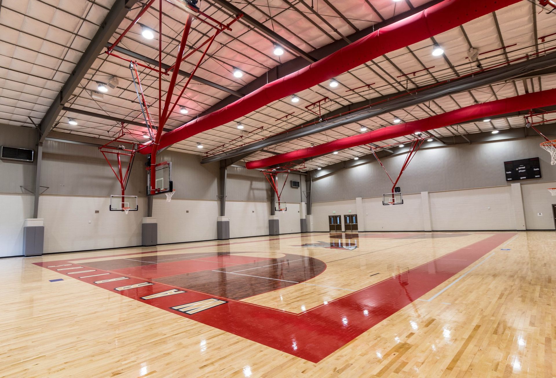 a basketball court with a red and white striped floor