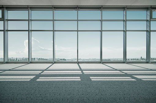 Empty room with city view.