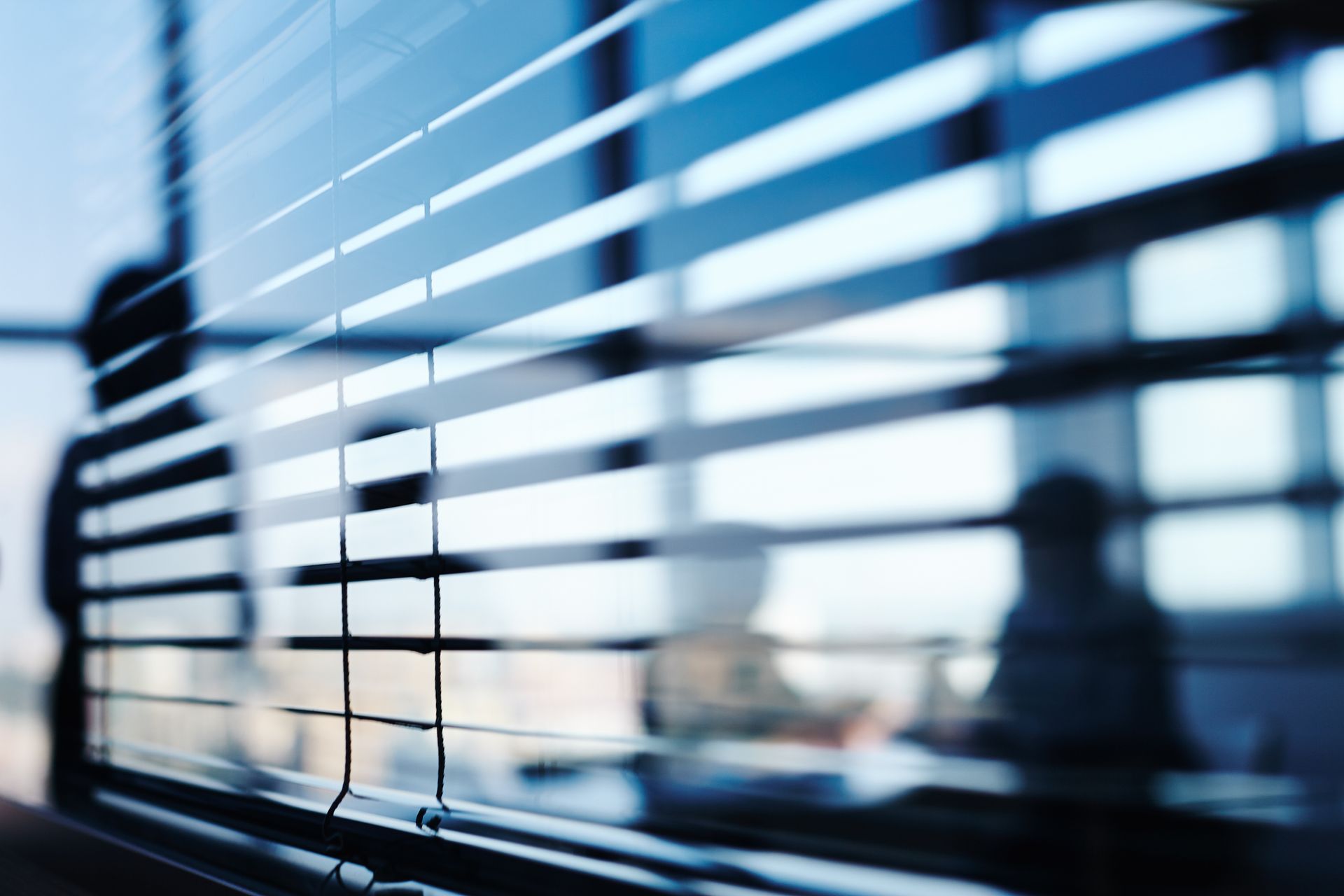 Close view of an office glass window with reflections on it.