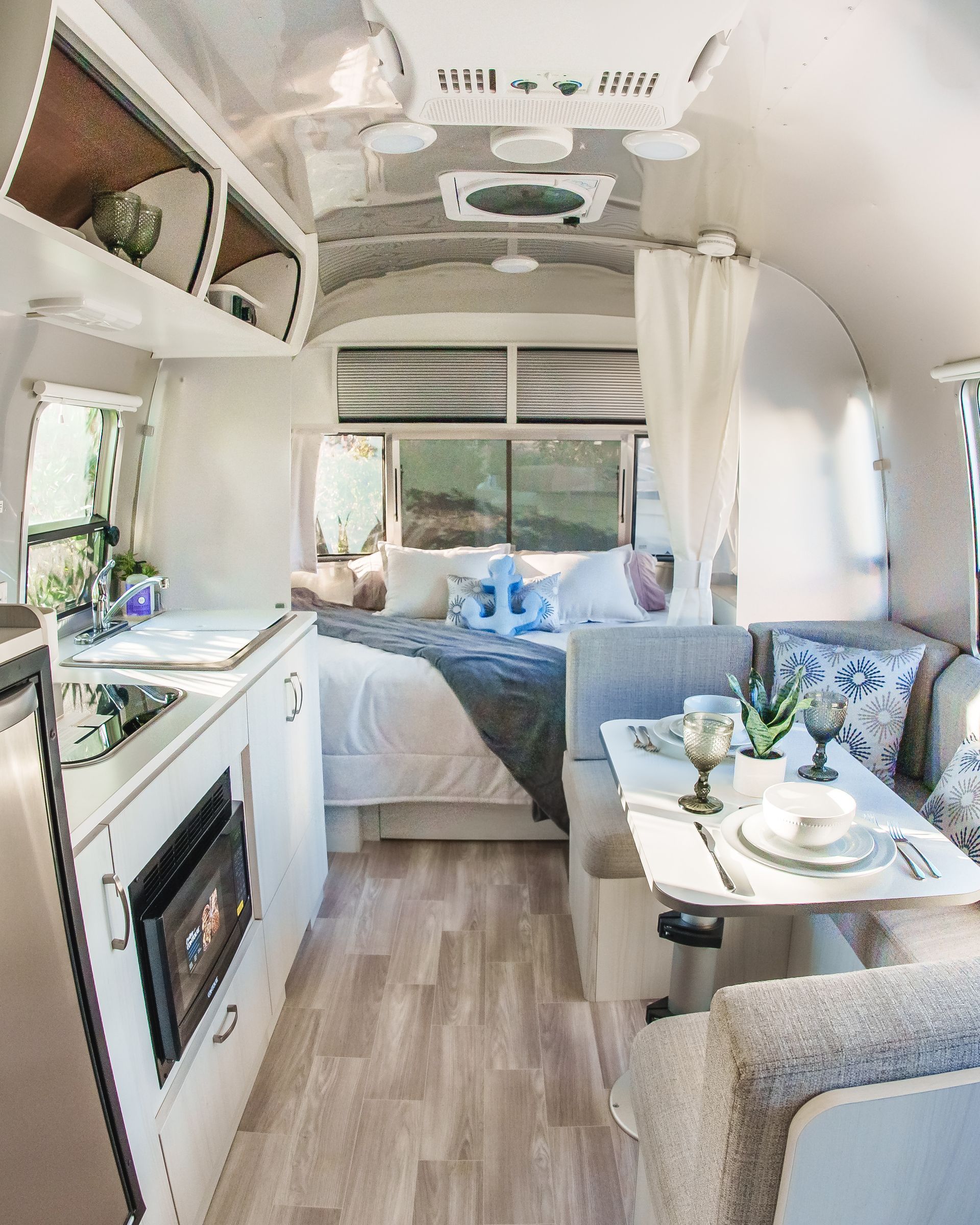 Close-up of cozy textures and beach-themed interior RV decor
