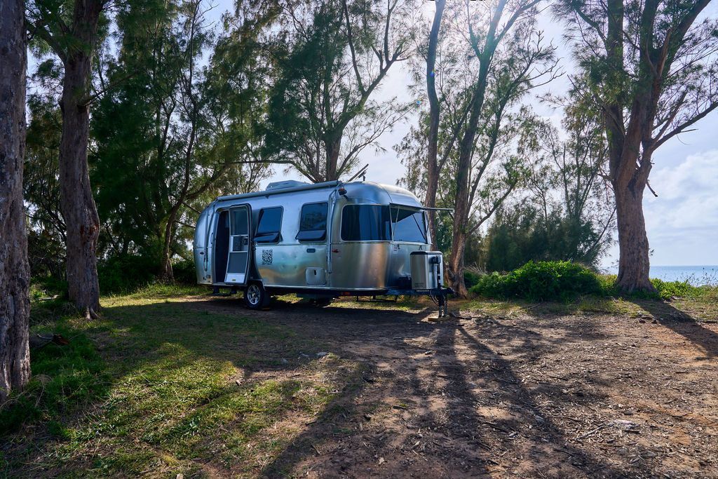 Eco-RV parked in shaded Coney Island location in Bermuda