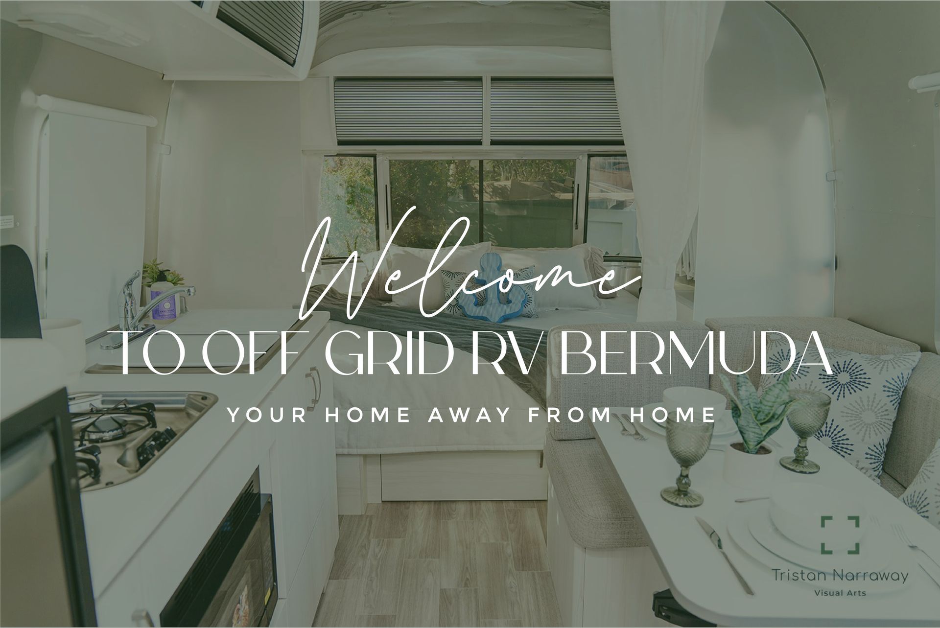 Welcome text over a bright white kitchen with a large window and green garden view