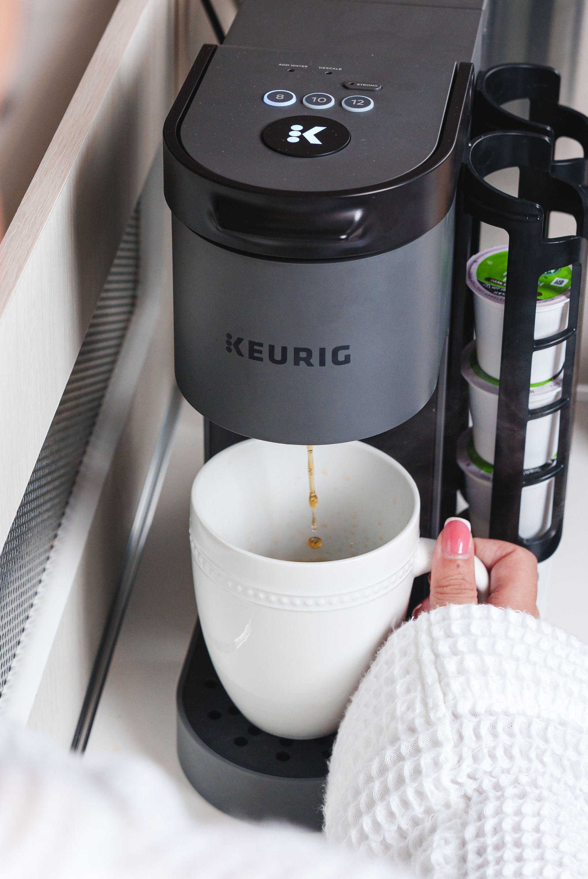 Compact Keurig coffee machine installed in RV kitchen