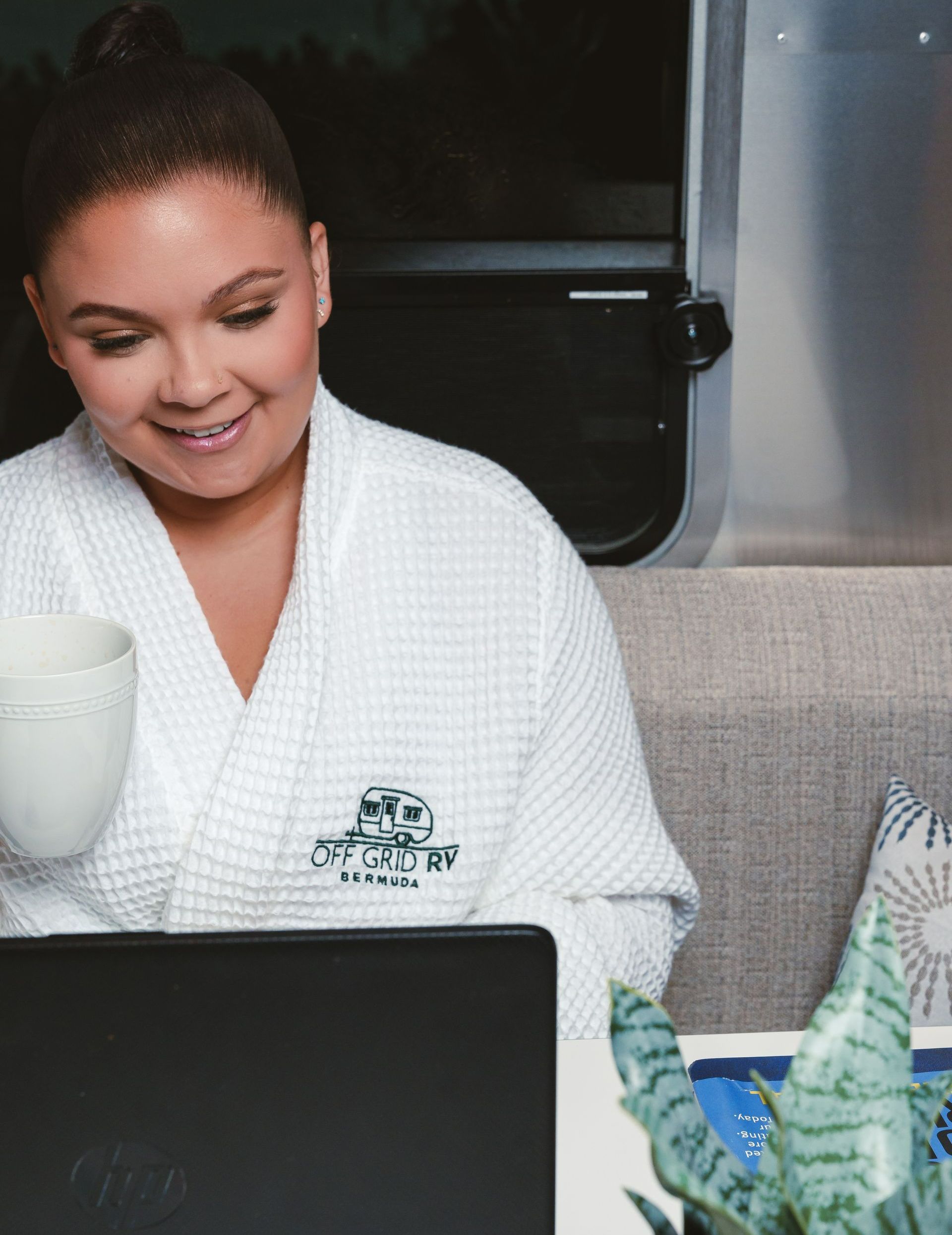 Guest smiling inside RV, enjoying comfortable stay