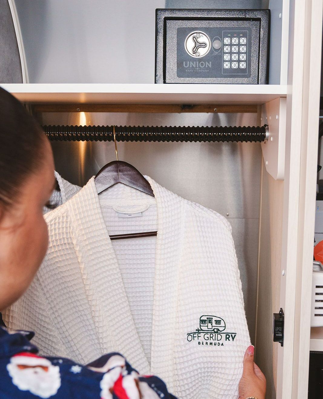 Mini safe and closet space inside luxury RV accommodation