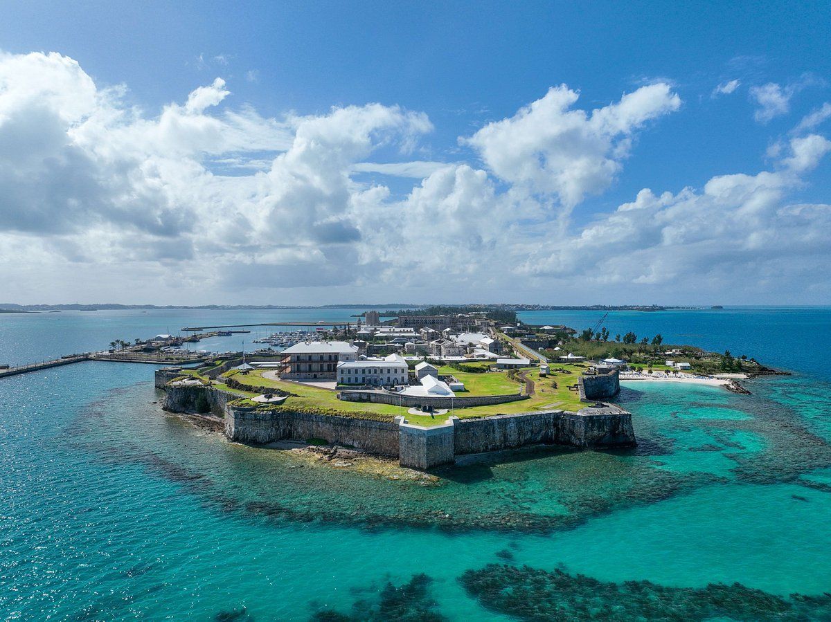 An aerial view of a small island in the middle of the ocean.