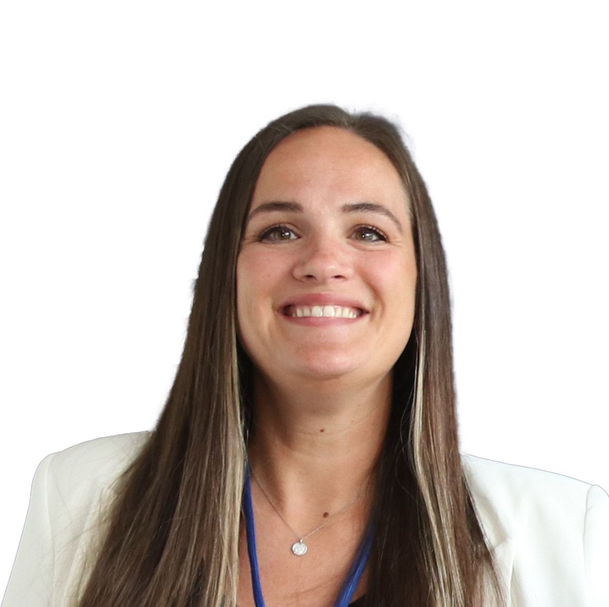 A woman wearing a white jacket and a blue lanyard is smiling.