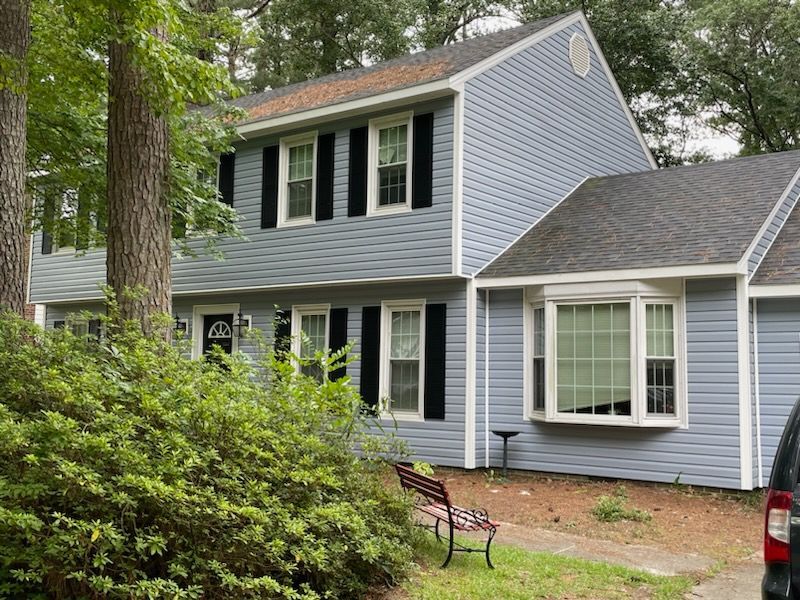 Blue vinyl siding replacement from the side