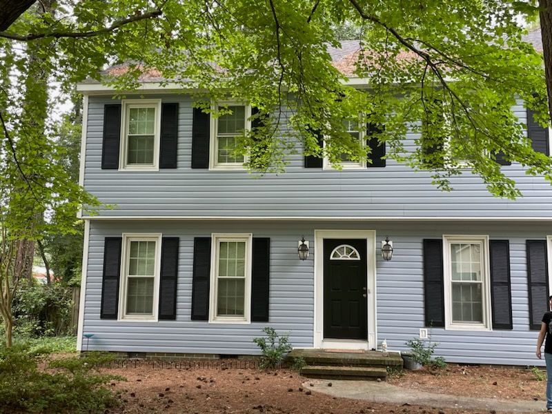 Blue vinyl siding replacement