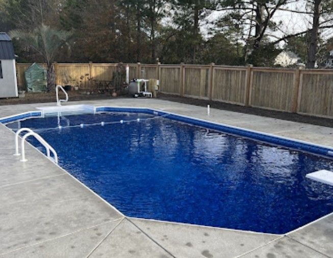 Finished inground grecian-shaped pool