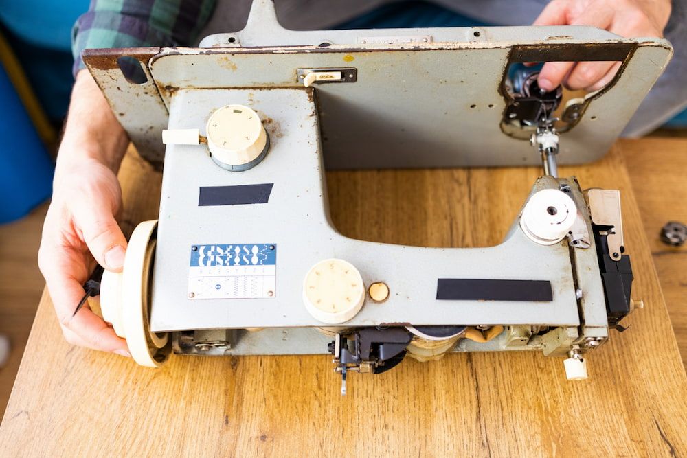 A Person is Fixing an Old Sewing Machine — James Hunter Mobile Sewing Machine Mechanic in Maroochydore, QLD