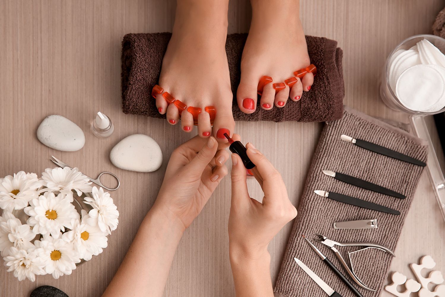 Client receiving treatment highlighting pedicure services in a beauty salon with a calming setting.