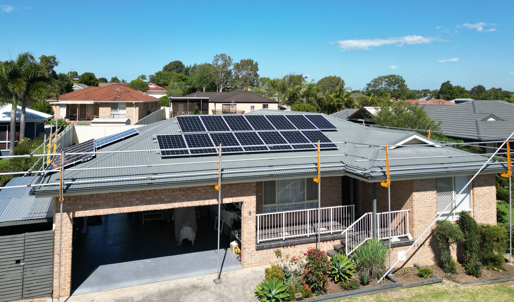 A House with Solar Panels on The Roof Before — Bulley Roof Restoration, Painting & Pressure Cleaning in Wingham, NSW