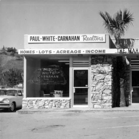 A black and white photo of paul white carnahan realtors