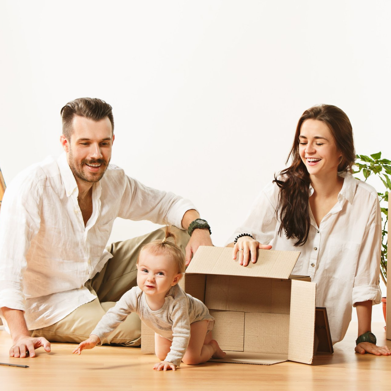 Couple with baby in a new home