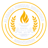 White and gold Alabama Funeral Directors Association seal with torch, laurel wreath, and AFDA 1957 text