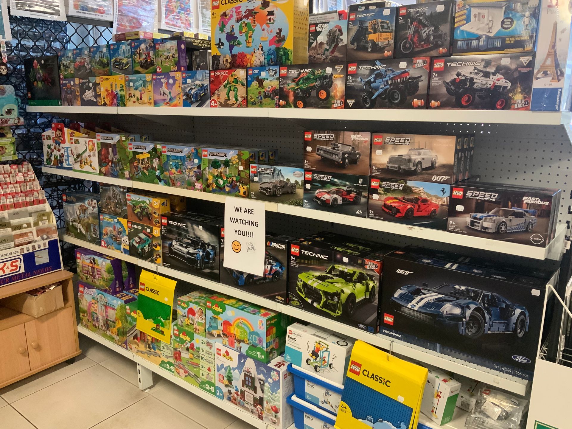Shelves Stocked With Various Lego Sets in a Store — Central Western Communications in Emerald, QLD