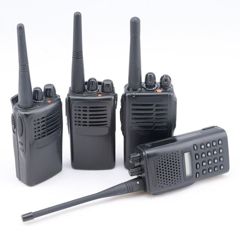 Four Black Walkie-talkies With Antennas Against a White Backdrop — Central Western Communications in Emerald, QLD