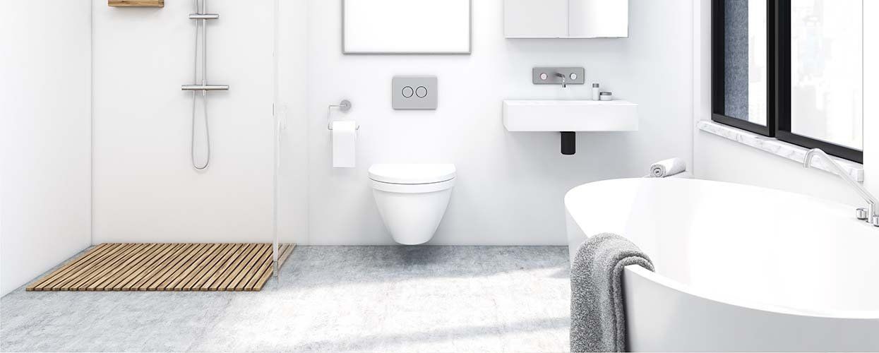 A bathroom with a bathtub , toilet , sink and shower.