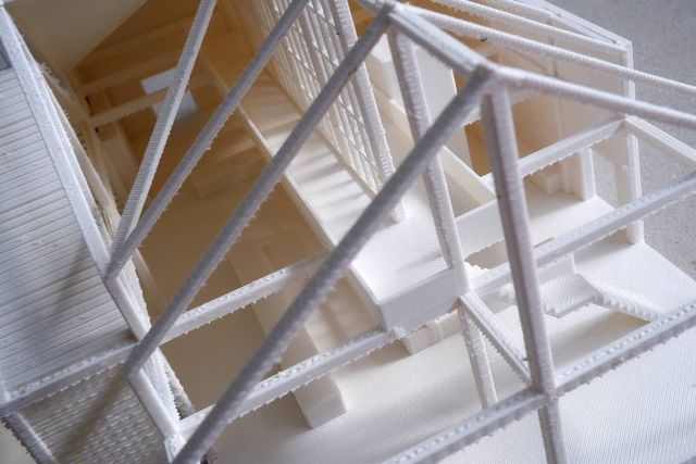 Close view of a 3D printed house model with roof frame