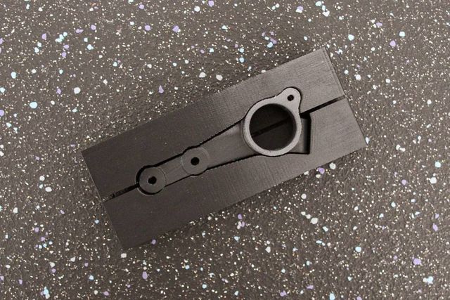 Composite 3D printed jig on a workbench