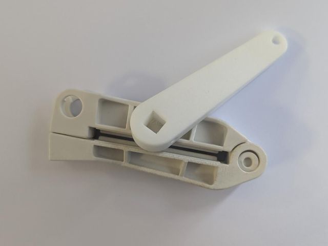 White 3D printed replacement hinge, closed