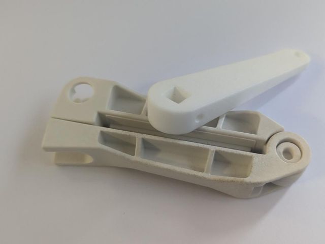 The same 3D printed replacement hinge, opened