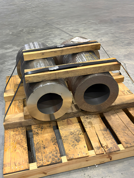 Pre-machined steel trunnions for a custom ball mill head assembly at Economy Ball Mill