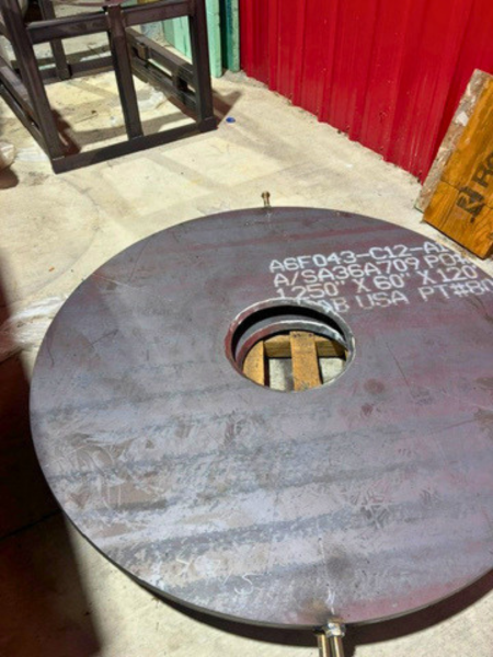 Steel ball mill head with center opening prepared for trunnion installation