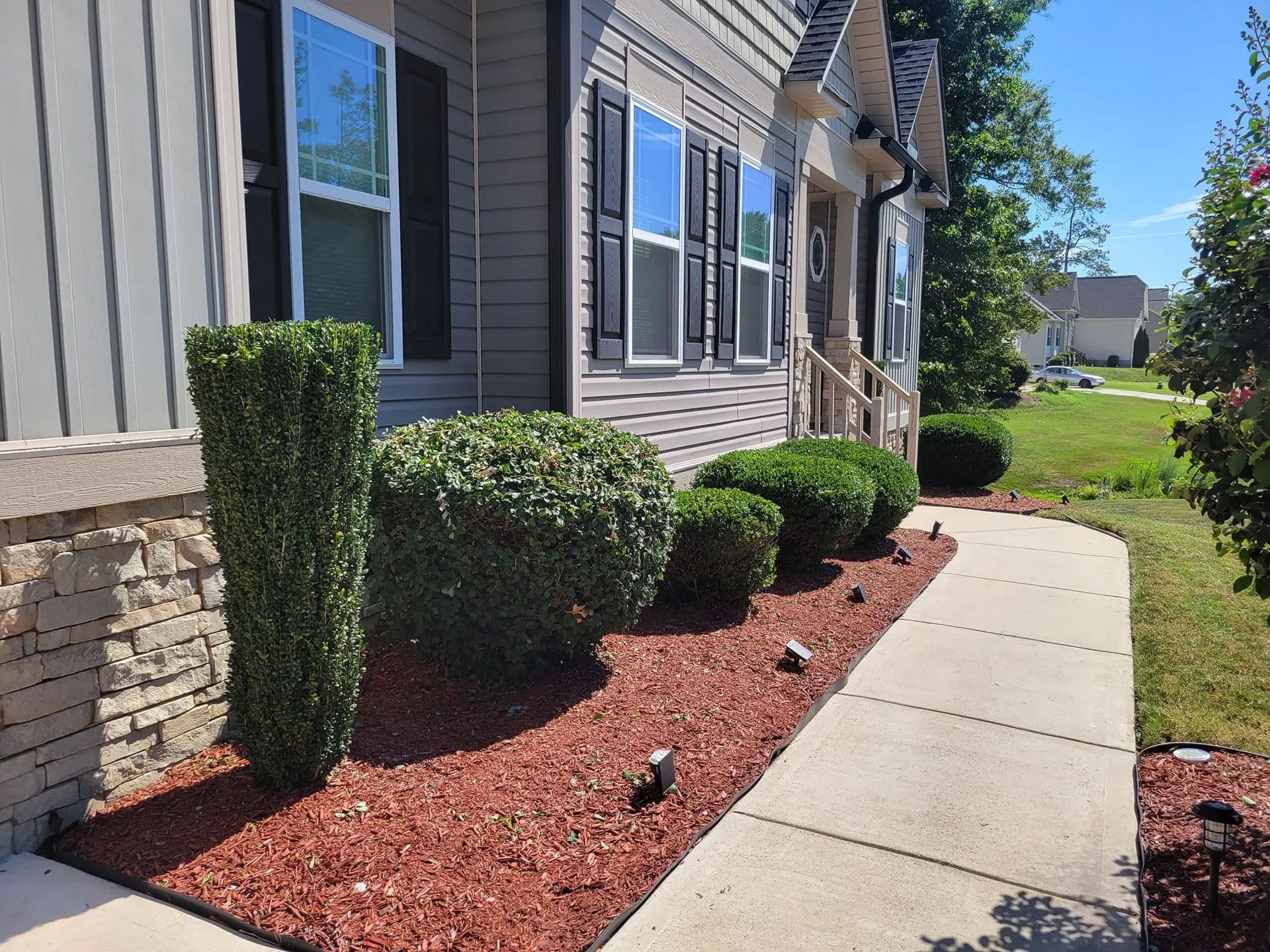 A walkway leading to the front of a house