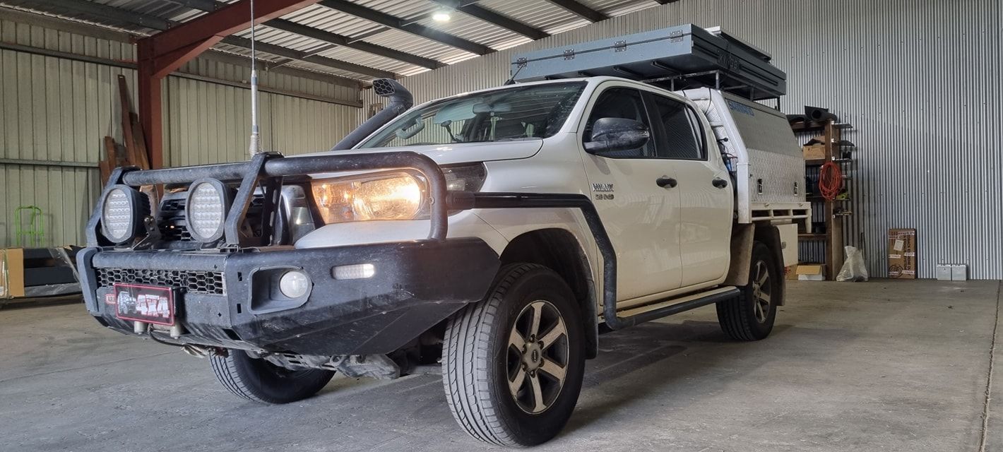 White Pickup Truck with Off-Road Accessories Parked Inside a Garage — Sparky's 4x4 In Muswellbrook, NSW