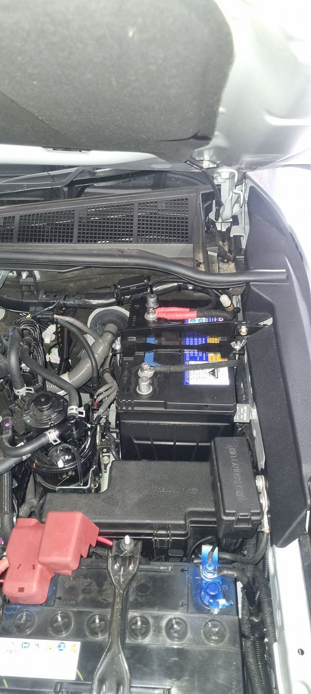 Car Engine Bay Showing the Battery, Fuse Boxes, and Engine Components — Sparky's 4x4 In Muswellbrook, NSW