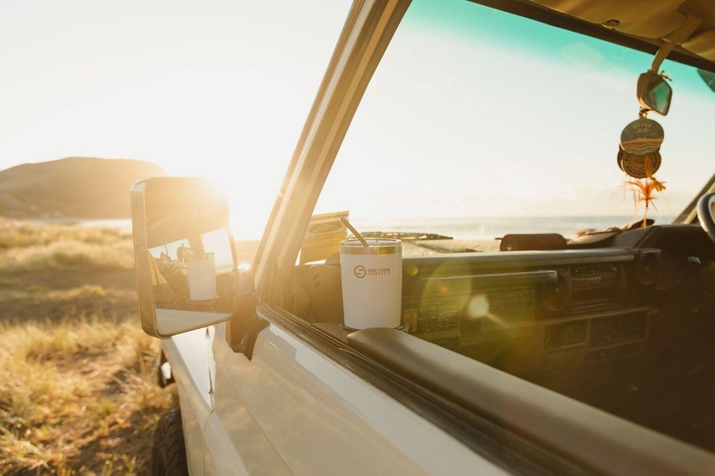 White Truck Parked Near Beach with A Drink on The Side — Sparky's 4x4 In Muswellbrook, NSW