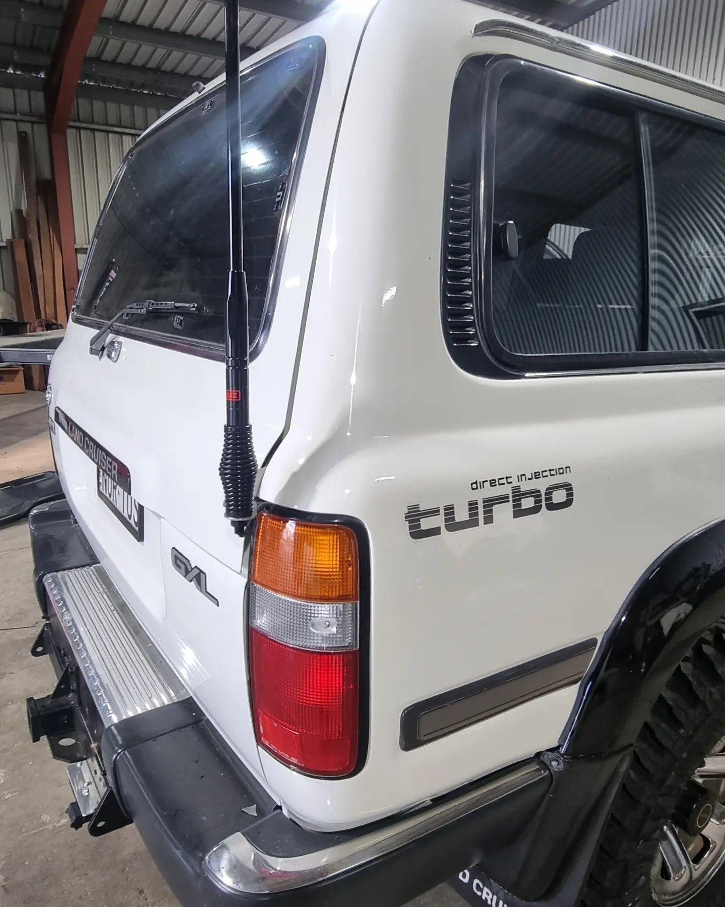 White Suv Rear with Black Antenna — Sparky's 4x4 In Taminda, NSW