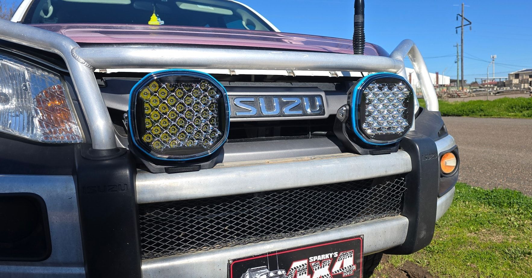 Silver Isuzu Truck with Spotlights on Front Bumper, Black Grill — Sparky's 4x4 In Gunnedah, NSW