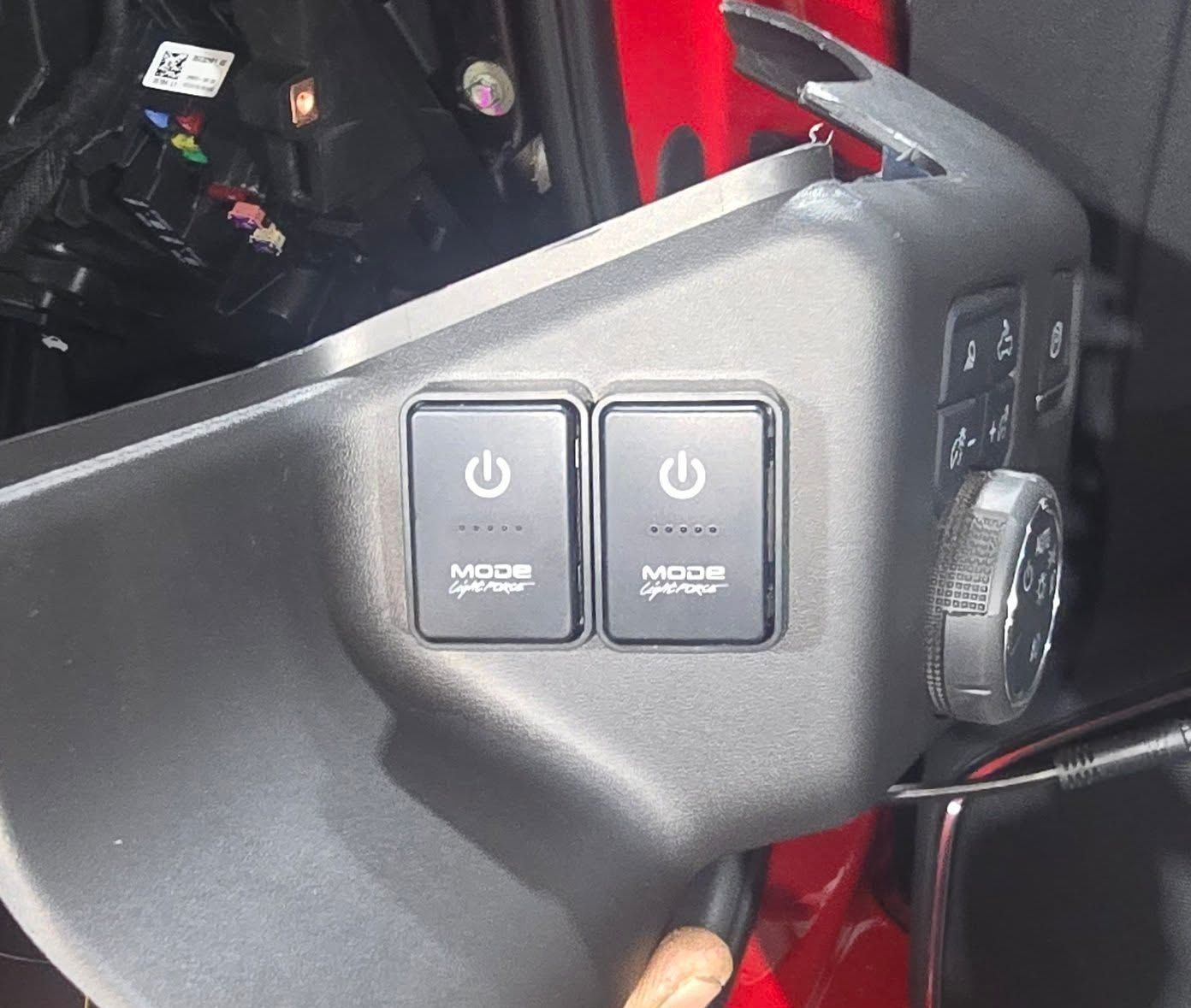 A Person is Holding a Pair of Switches That Say Mode on Them — Sparky's 4x4 In Taminda, NSW