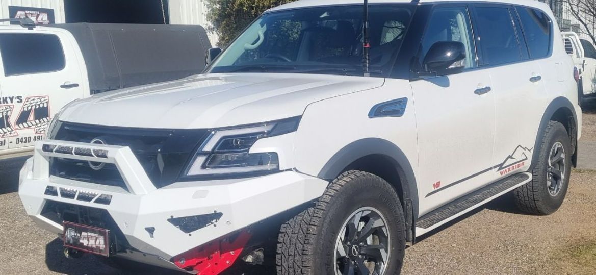 A White Nissan Patrol is Parked on the Side of the Road — Sparky's 4x4 In Taminda, NSW