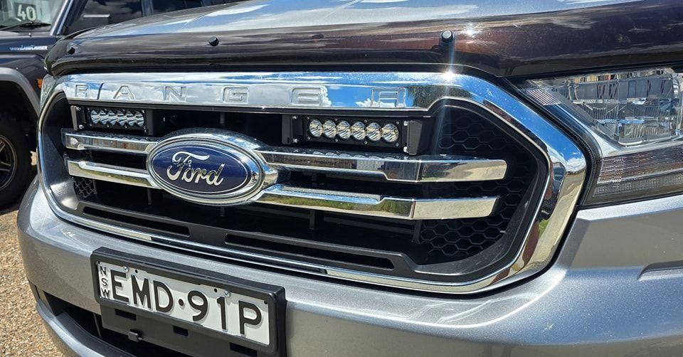 The Front Grille of a Ford Ranger With a License Plate — Sparky's 4x4 In Taminda, NSW
