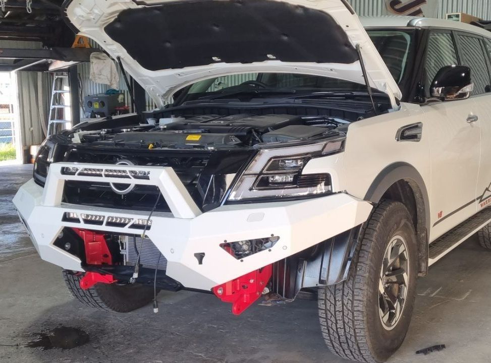 A White Suv With the Hood Open is Parked in a Garage — Sparky's 4x4 In Taminda, NSW