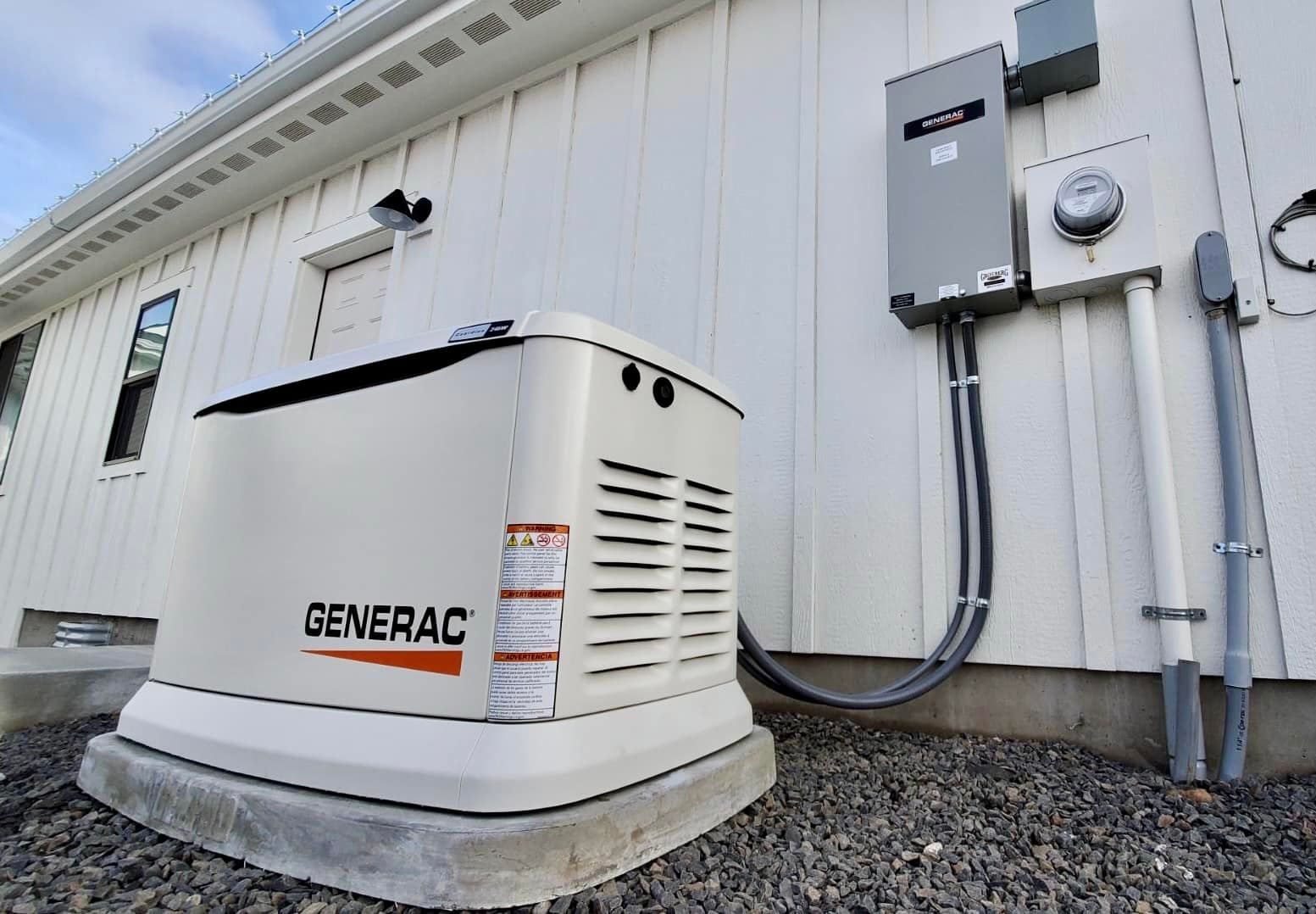 Outdoor Generac standby generator beside a building wall with electrical panels and conduit