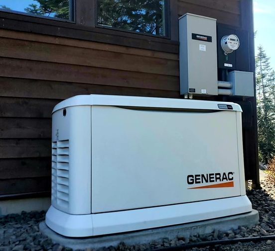 White Generac generator beside a house exterior, with electrical equipment mounted above it.