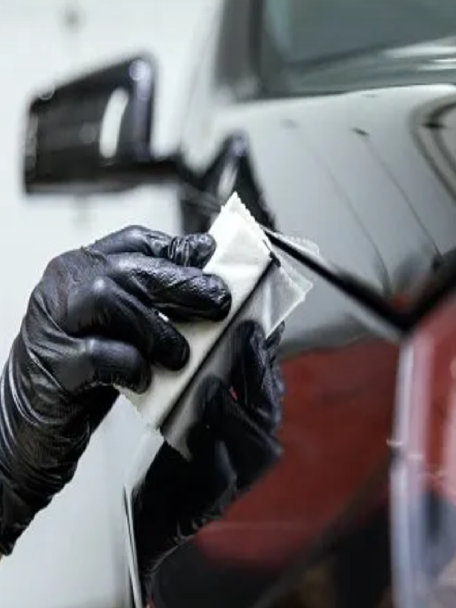 Applying ceramic coating to a vehicle’s surface for protection.