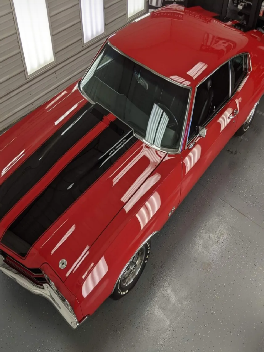 Red classic car ready for ceramic coating application.